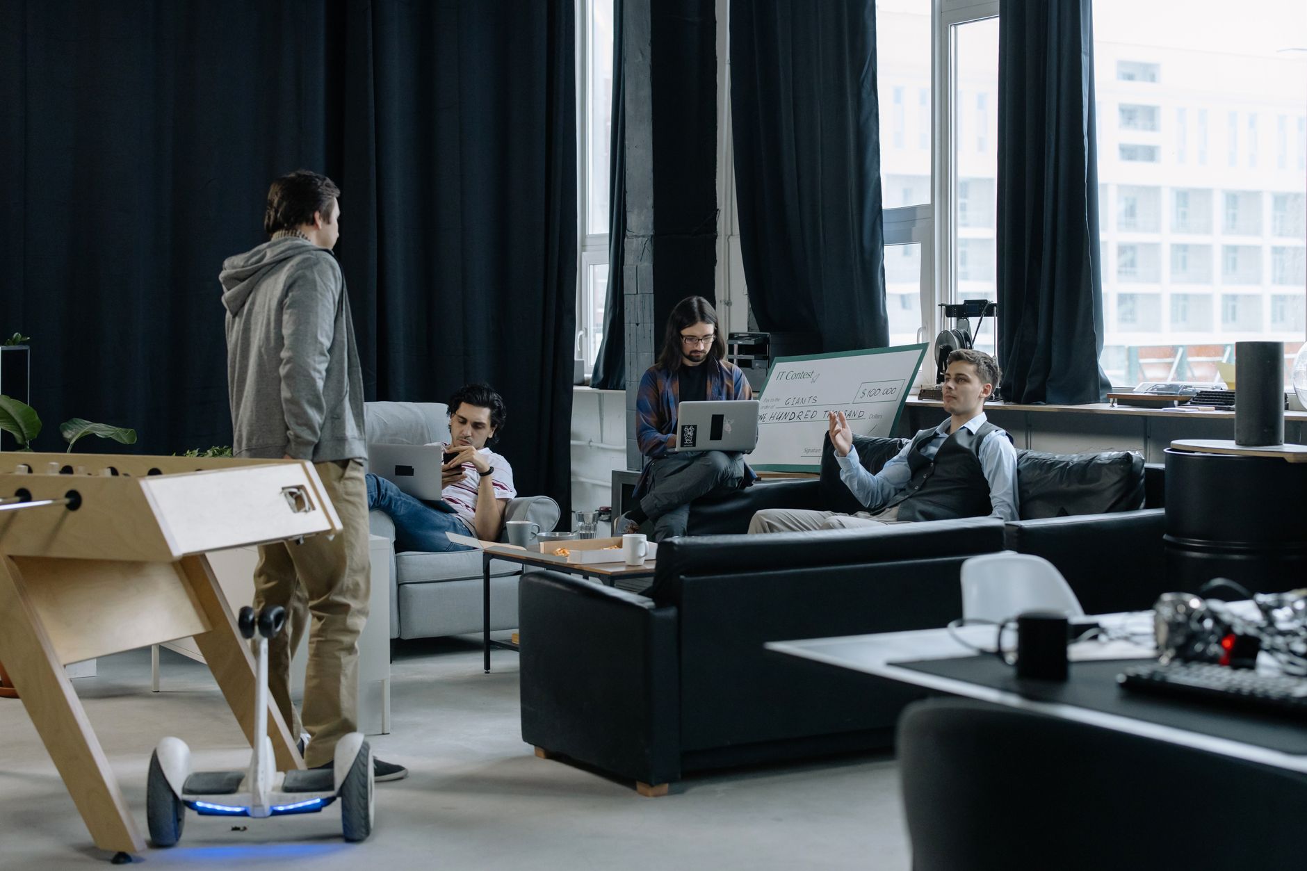 Group of young professionals collaborating in a creative and modern office space.